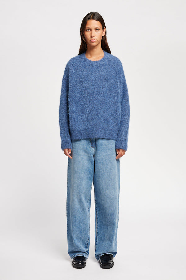 Front view of Model wearing alpaca blend Laurel Crew Neck Knit Sweater in indigo marle 