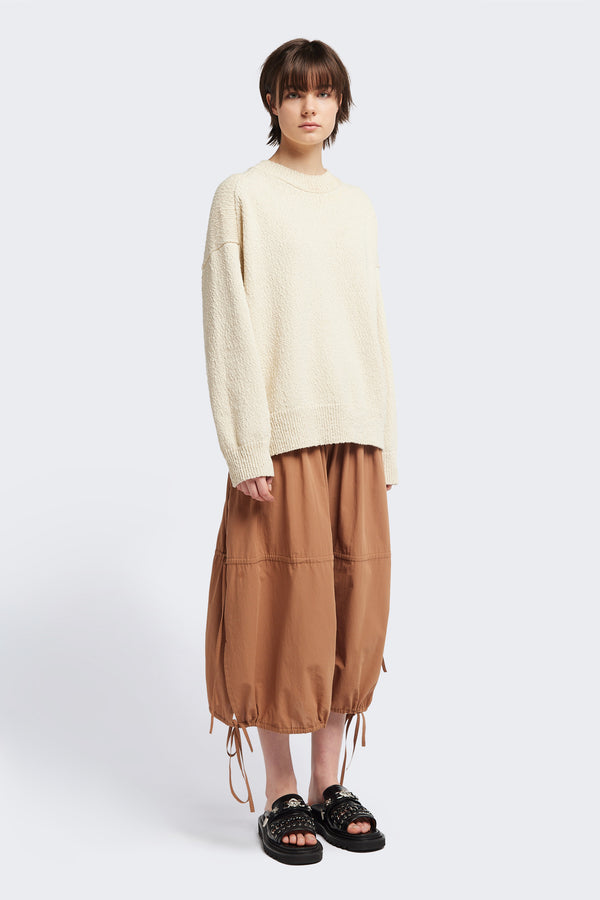 Front of the Ecru Leeway Sweater in a soft chunky cotton knit, featuring an oversized relaxed fit, raglan sleeves, and ribbed hem and cuffs.