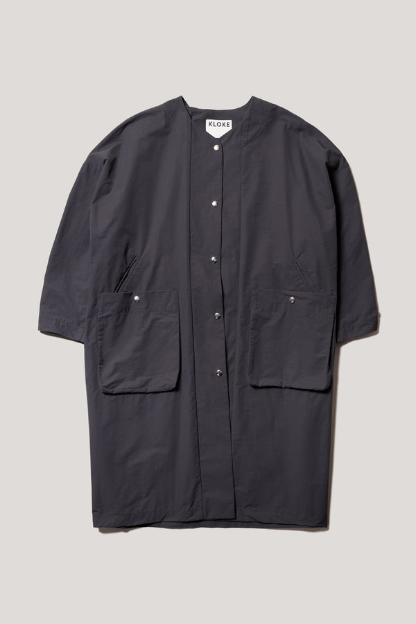 Flat Front view of the Slate Locate Jacket, with centre-front button closure and rounded neckline.