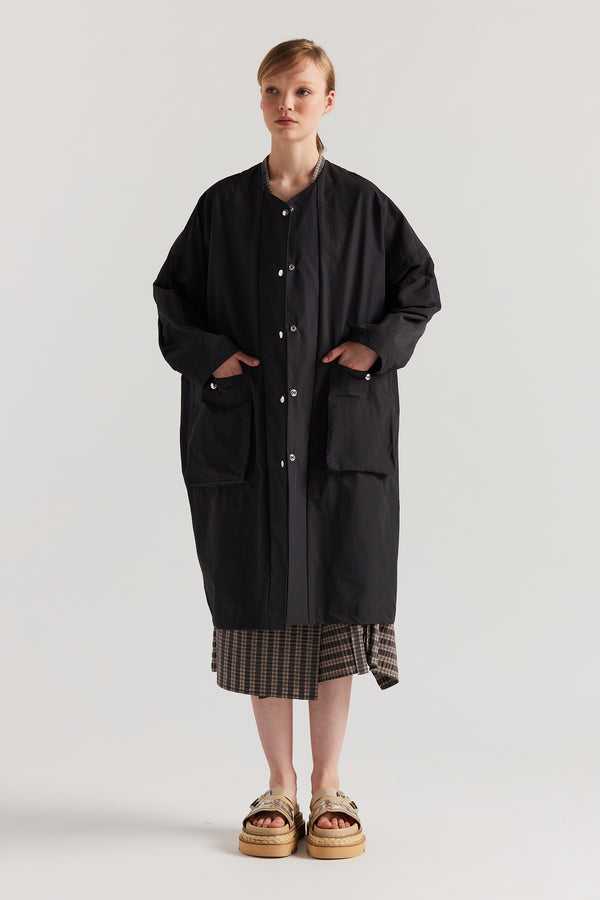 Front view of the Slate Locate Jacket on model with centre-front button closure and rounded neckline.