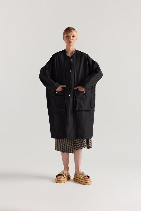 Front view of the Slate Locate Jacket on model with centre-front button closure and rounded neckline.