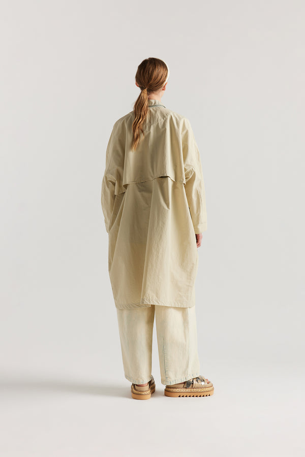 Back view of the Stone Locate Jacket on model highlighting the storm flap and longer silhouette.