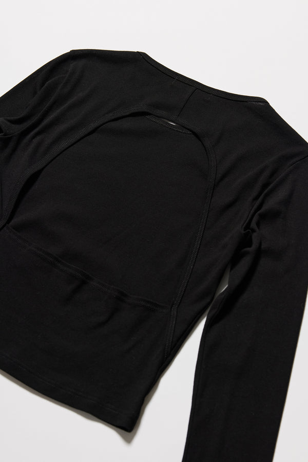 Close up fabric and detail shot of the Mist Ballet Top in black, highlighting the back opening detail