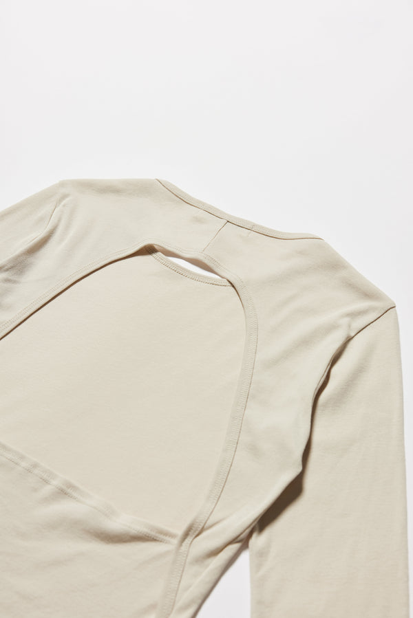 Close up fabric and detail shot of the Mist Ballet Top in bone of white, highlighting the back opening detail