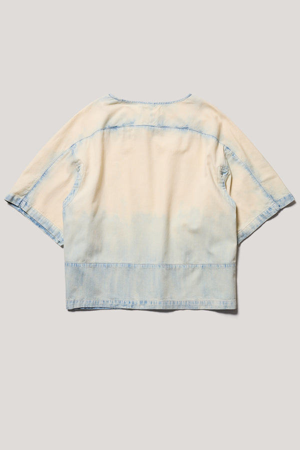 Flat Back of the Norton Top in Mid blue fade with Ecru tint denim, showing split underarm detail and engineered paneling. 