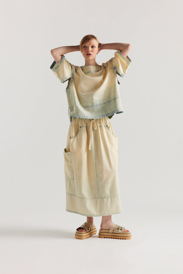 Front view of the Norton Top in Mid blue fade with Ecru tint denim, showing split underarm detail and round neck silhouette.