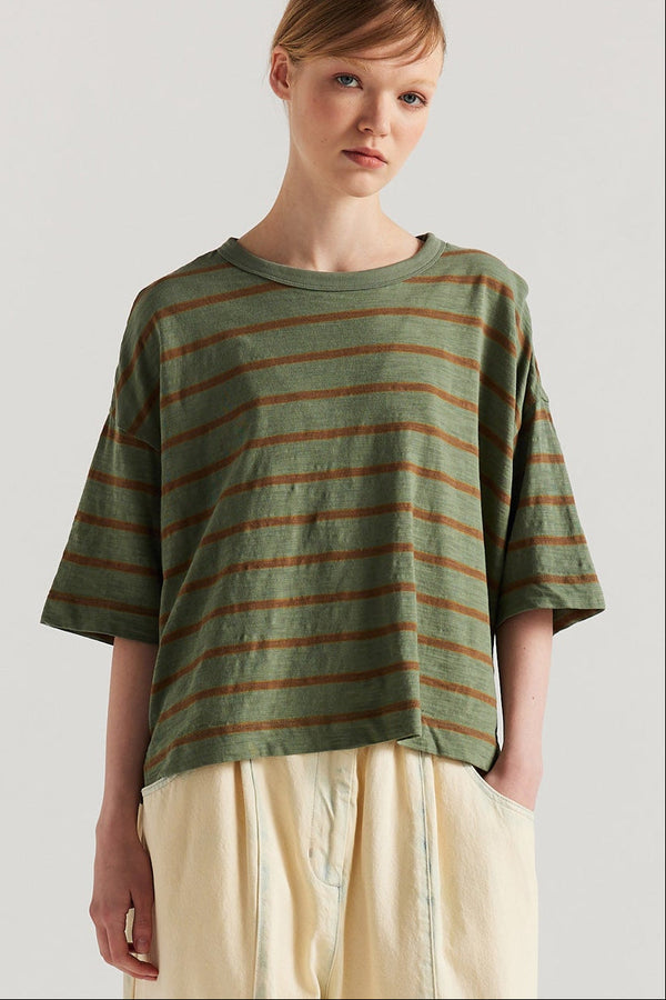 Front view of model in the Olive/Tan stripe, Obelisk Feeder Stripe Tee in yarn-dyed slub cotton with relaxed boxy fit