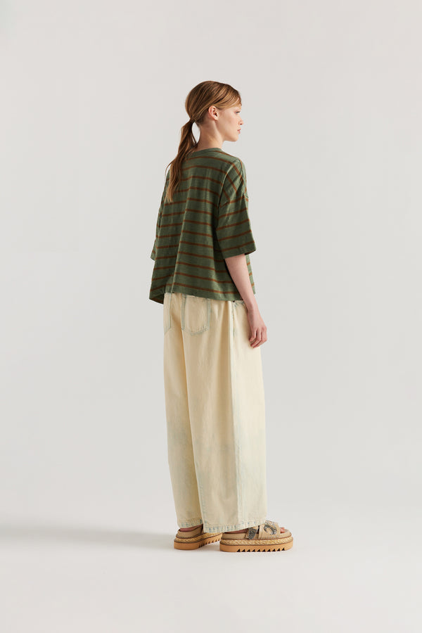 Back view of model in the Olive/Tan stripe, Obelisk Feeder Stripe Tee in yarn-dyed slub cotton with relaxed boxy fit
