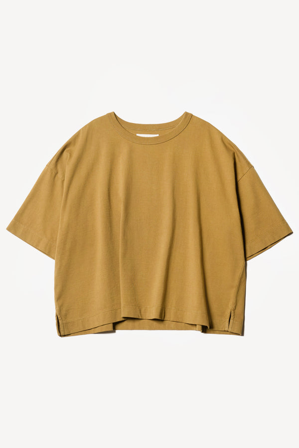 flat front of Obelisk Tee in Olive oil, showing relaxed fit and straight hem with side split