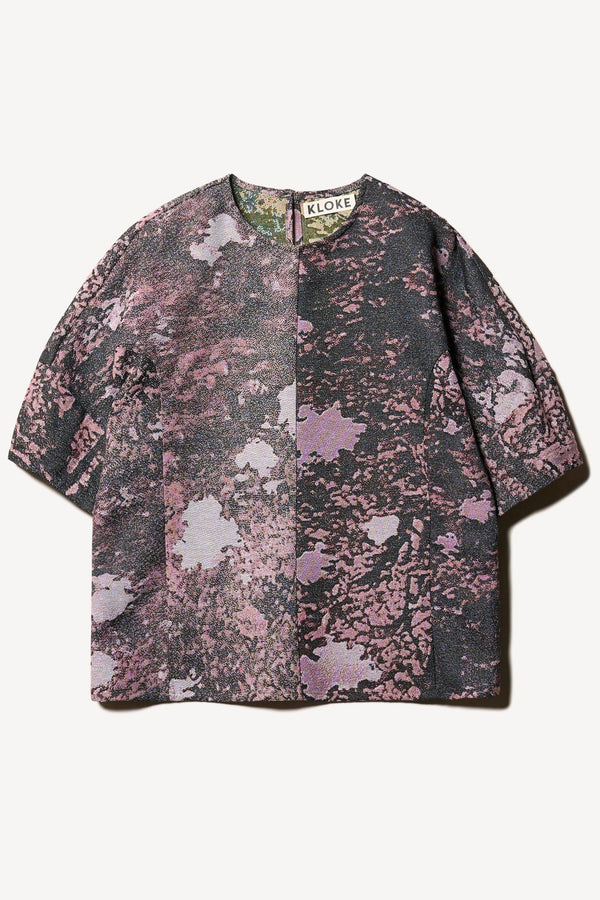 Flat front of the forge top in purple print featuring a unique woven jacquard fabric with real tree camouflage pattern, sculptured panelled sleeves, and a contemporary fit