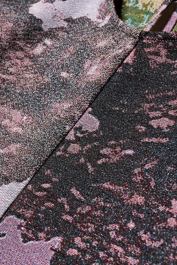 Close up fabric detail shot of the forge top in purple print featuring a unique woven jacquard fabric with real tree camouflage pattern, sculptured panelled sleeves, and a contemporary fit
