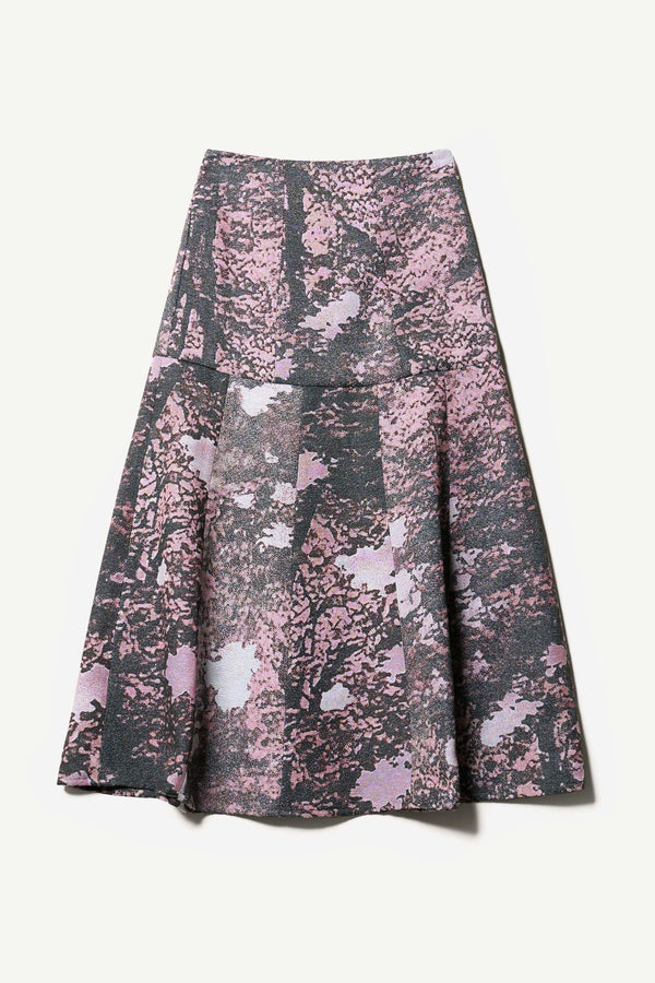 Flat Front of the Optic Skirt a midi-length A-line skirt in textured jacquard purple print fabric with a forest-inspired pattern, designed by Kloke