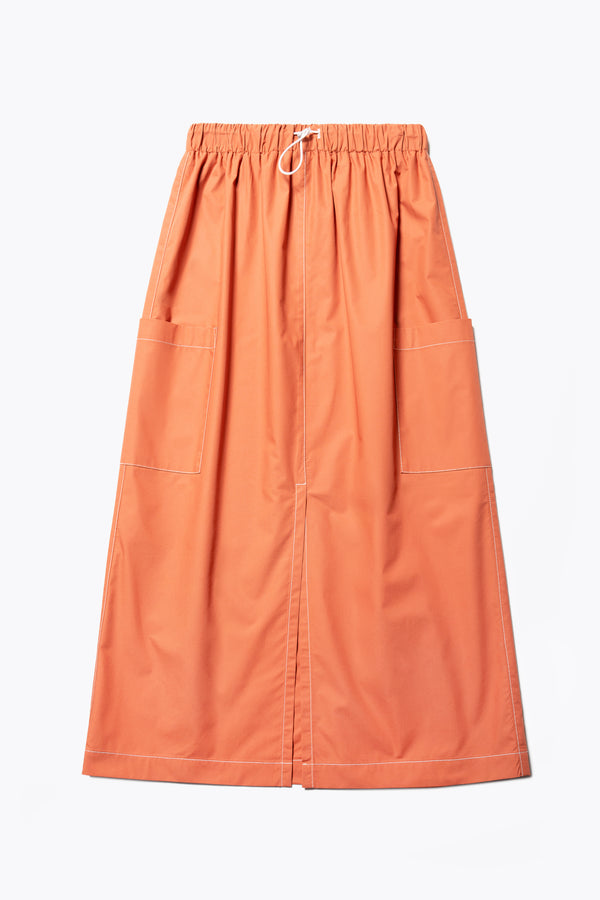 The Opus Skirt Rust with white contrast topstitch is a straight, mid-length skirt. With a centre-front split, side patch-pockets and elasticated waits with toggle adjustment this skirt is easy to wear and comfortable. 