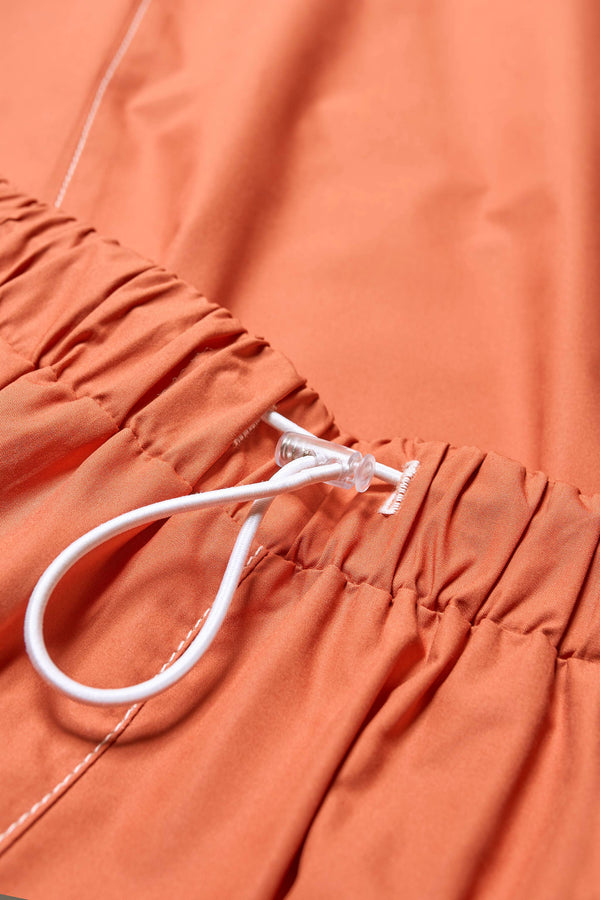 The Opus Skirt Rust has an elasticated waist with toggle adjustment for comfort. Made from 100% cotton. 