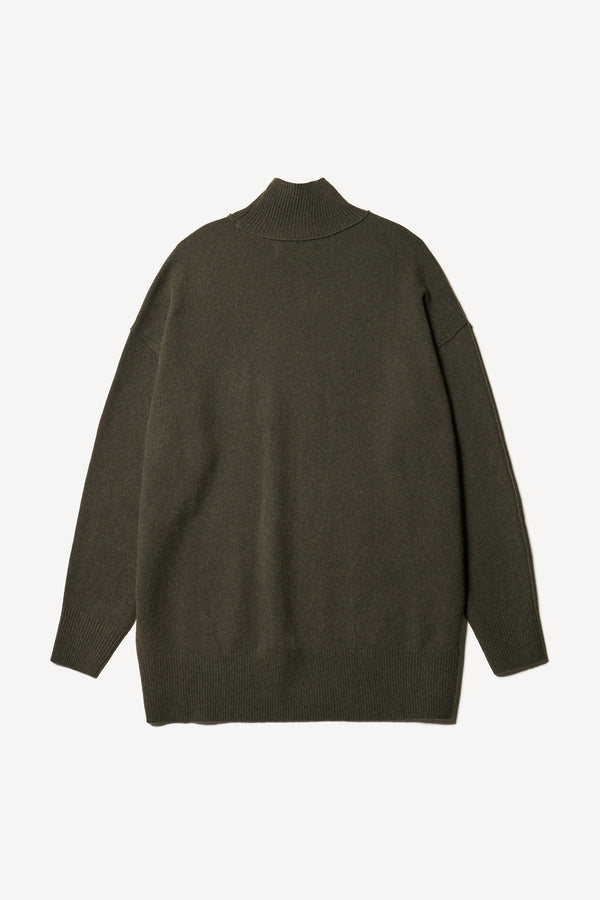 Flat back of the Overflow long knit, high neck wool blend sweater with exposed seams in darkest green