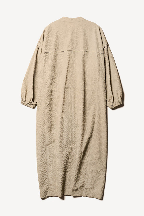 Flat back of the Parapet Dress in a Stone/beige lightweight seersucker nylon.