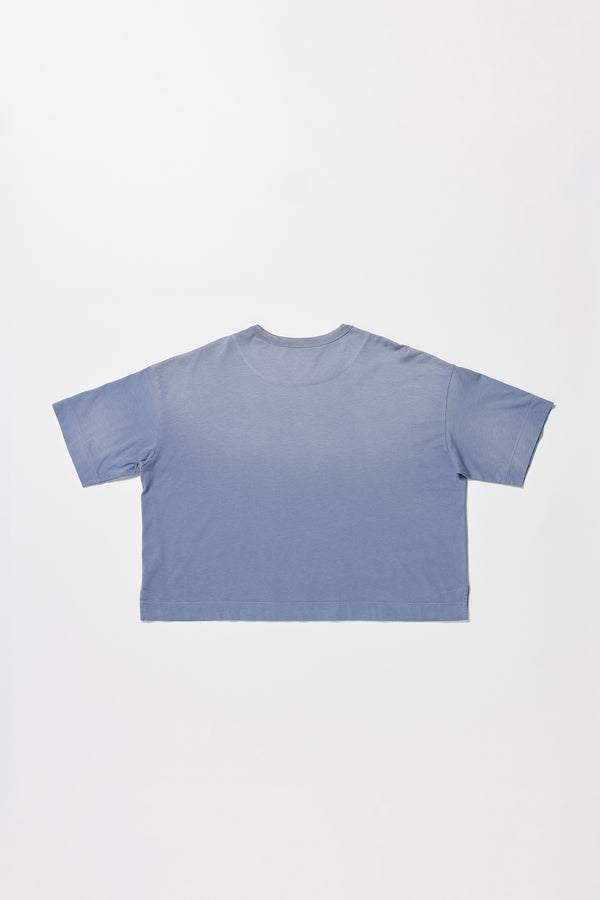flat back of Passage Tee in blue fade, showing relaxed fit and straight hem with side split