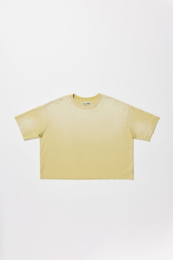 Flat front of the Passage Tee in chartreuse, showcasing oversized silhouette and dropped shoulders
