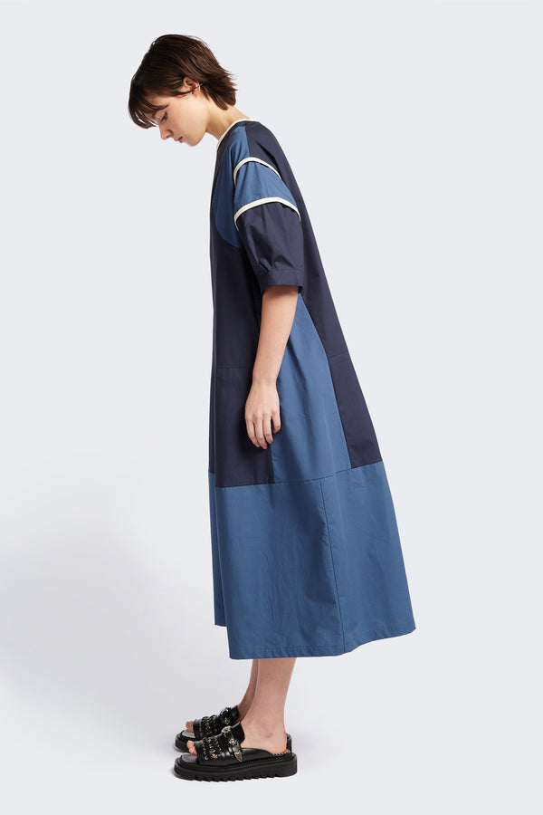 Side of The Patch dress in Blue, a colour-block dress with tonal hues, contrast-bound seams, round neckline with keyhole back, dropped sleeves with tucks, and a slightly flared skirt, perfect for a summer vibe.