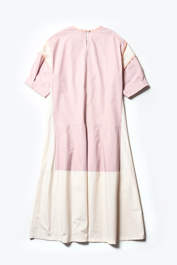 Flat Back of The Patch dress in Peach, a colour-block dress with tonal hues, contrast-bound seams, round neckline with keyhole back, dropped sleeves with tucks, and a slightly flared skirt, perfect for a summer vibe.