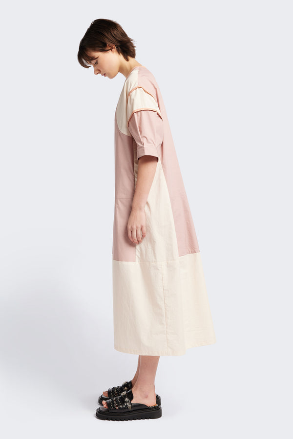 Side of The Patch dress in Peach, a colour-block dress with tonal hues, contrast-bound seams, round neckline with keyhole back, dropped sleeves with tucks, and a slightly flared skirt, perfect for a summer vibe.