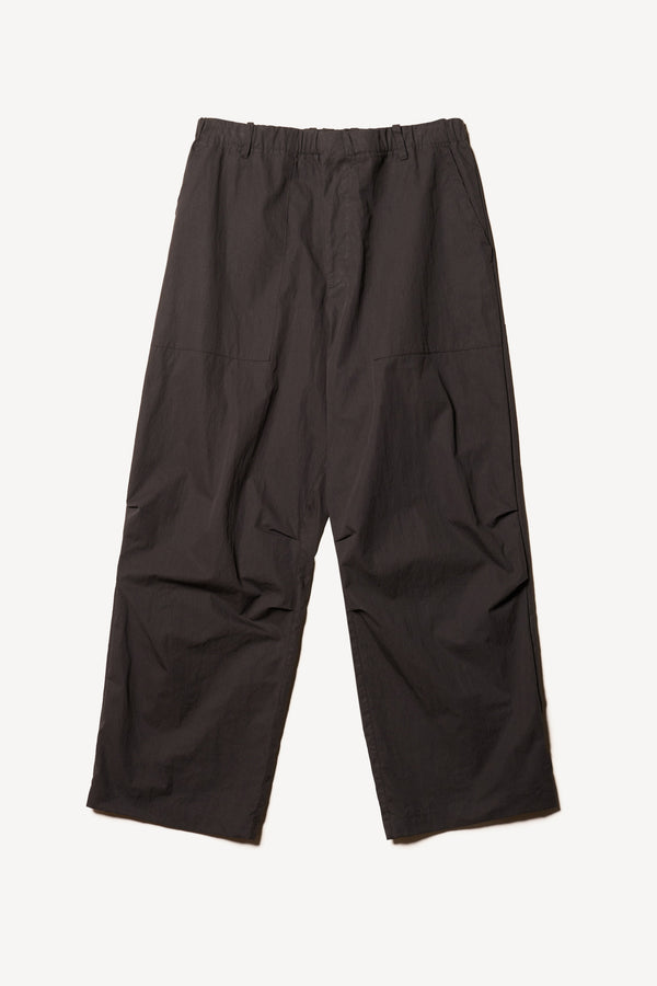 Flat Front of the Premise Cargo in Jet Black, a relaxed-fit pant with adjustable waistband, clean front pleats, and straight-leg silhouette.