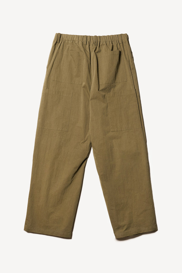 Flat Back the Premise Cargo in Kelp Green, a relaxed-fit pant with adjustable waistband, clean front pleats, and straight-leg silhouette.