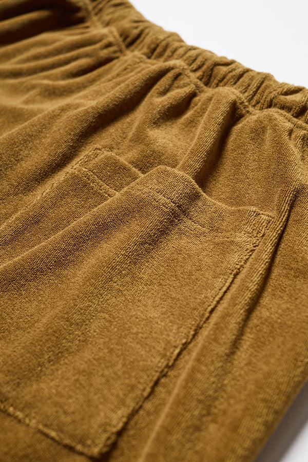 Detail view of the purple Oeko-Tex certified coffee brown cotton terry 
