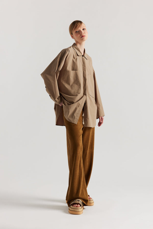 Front view of slouchy track pants in coffee brown cotton terry with straight-leg fit and cord-tie waistband.