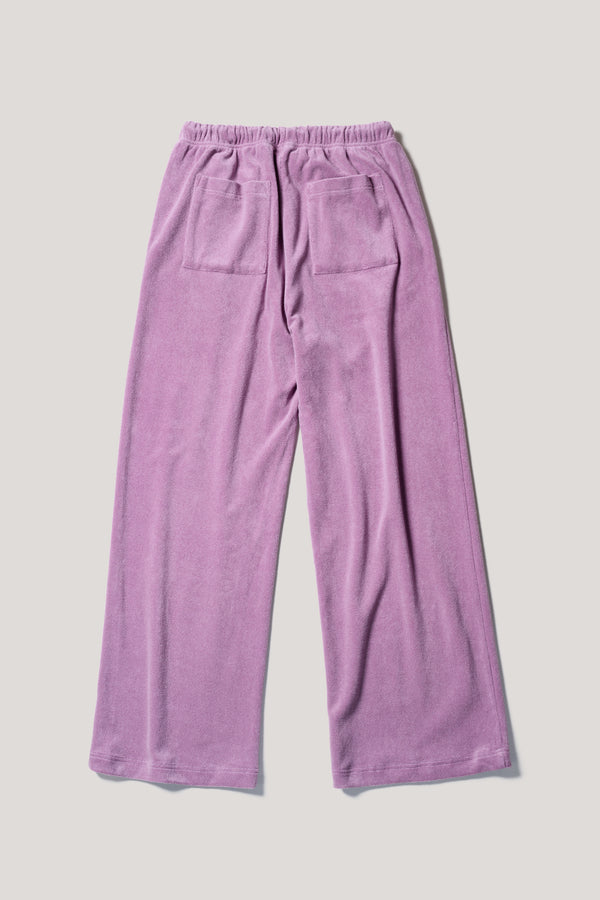 Flat front of slouchy track pants in purple cotton terry with straight-leg fit and cord-tie waistband.