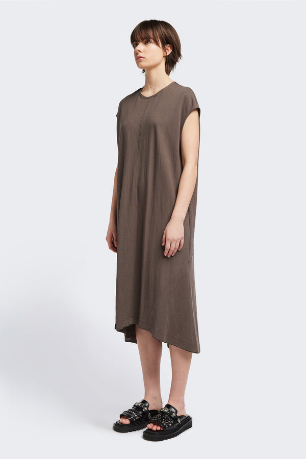 Front of the Recess dress in taupe, a sleeveless crew-neck midi dress with exposed seams, raw-edge finish, and a relaxed silhouette that falls just below the knees, offering a versatile look for casual or elevated occasions.