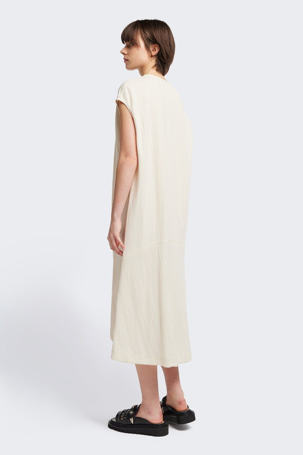 Back of the Recess dress in ecru, a sleeveless crew-neck midi dress with exposed seams, raw-edge finish, and a relaxed silhouette that falls just below the knees, offering a versatile look for casual or elevated occasions.