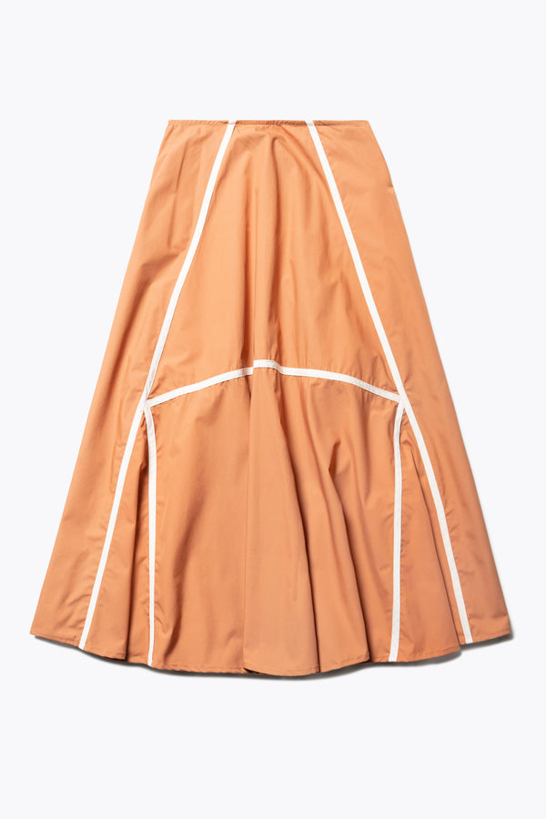 Flat front of the burnt orange/Ecru Regarder Bound Skirt in a lightweight cotton fabric, featuring a fuller silhouette with contrast bound seam details, midi length, and a back invisible zip closure.