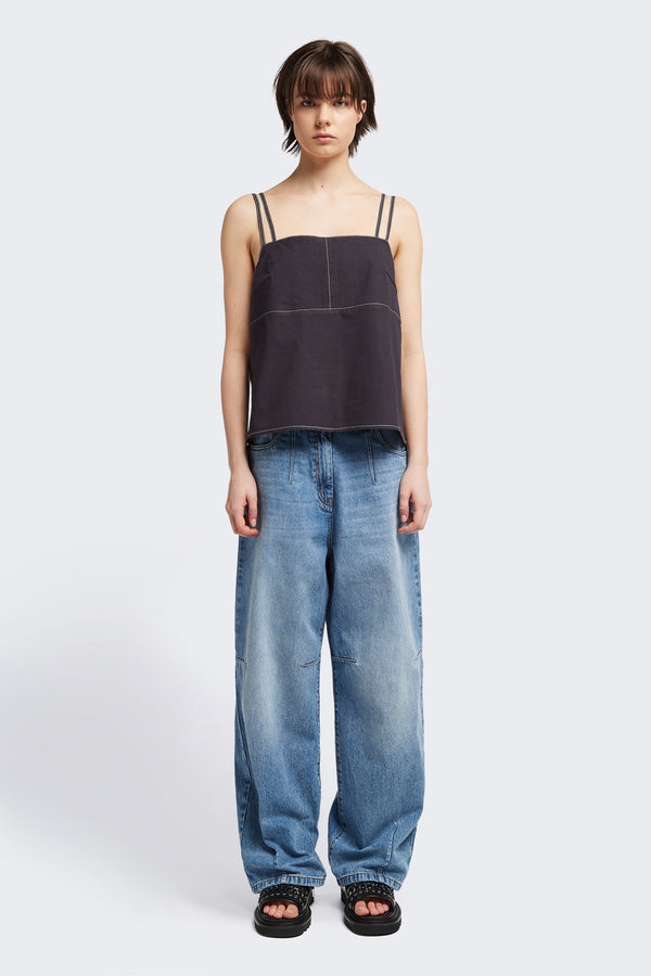Front view of model in the the Reset Jean, a darted relaxed baggy jean - in mid blue fade