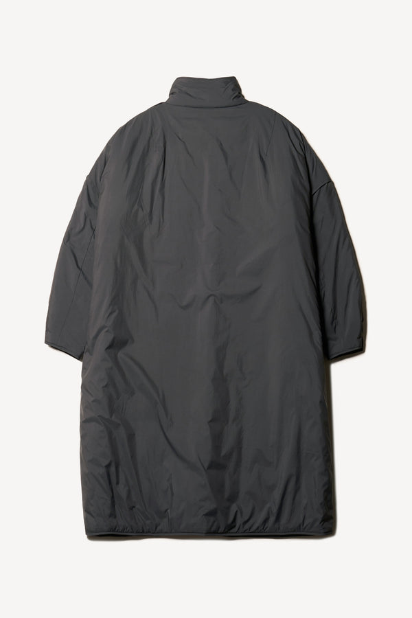 Flat Back view of the oversized Restore Coat in Black, showcasing  relaxed silhouette and clean lines