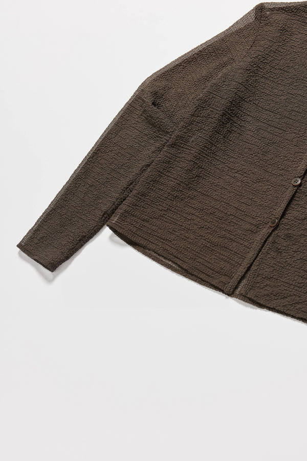 Close-up of Rising LS Shirt in Brown showing rounded self-bind collar and subtle textured lightweight fabric.
