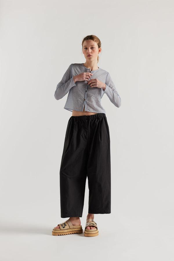 Front View of model in the Rising LS Shirt in Pale Blue. A slim-fitting long sleeve shirt with rounded self-bind collar and straight hem.