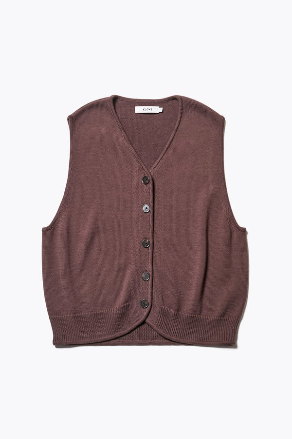 The Ritual Vest in Brown soft cotton rib, featuring a shallow V-neckline and centre front button placket. A versatile trans-seasonal layering piece, available in 5 sizes. 