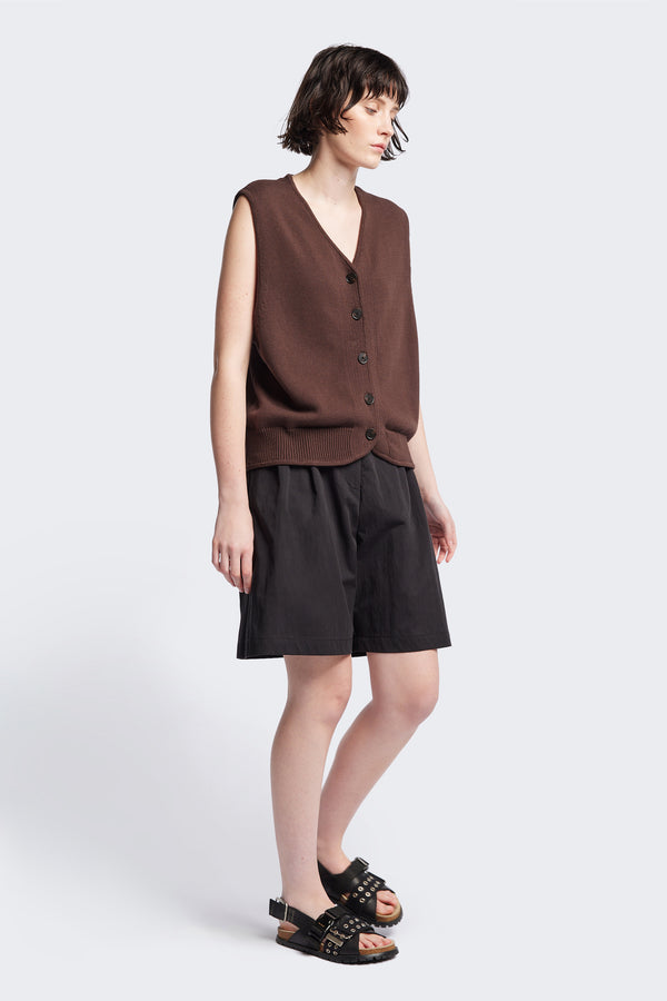 The Ritual Vest in Brown soft cotton rib, featuring a shallow V-neckline and centre front button placket. A versatile trans-seasonal layering piece, available in 5 sizes. 