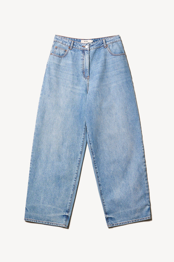 Flat front view of Kloke straight-leg jeans in mid-blue Japanese denim, featuring a mid-rise waist and relaxed silhouette."