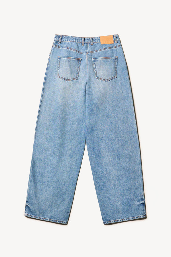 Flat back view of Kloke straight-leg jeans in mid-blue Japanese denim, featuring a mid-rise waist and relaxed silhouette."