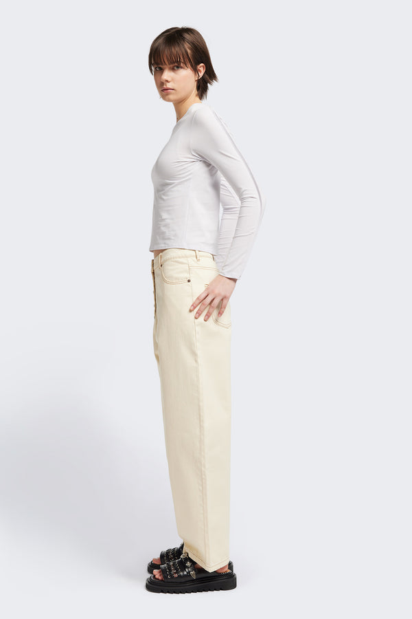 Side view of the Seclude long sleeve top in ice blue. A Slim-fit crew neck top in soft cotton stretch, featuring an exposed bound seam curving across the back and sleeves.