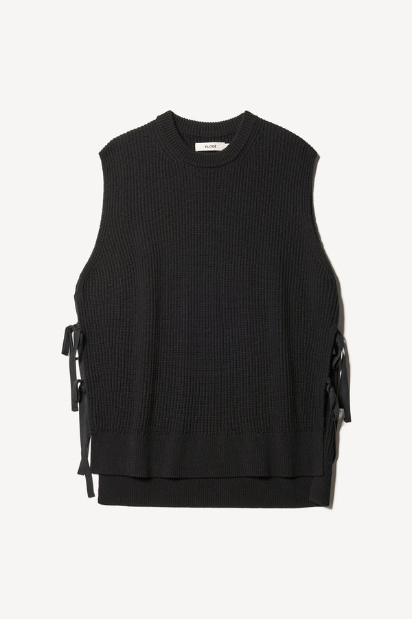 Flat Front view of blck sleeveless ribbed knit vest with side ties in merino and cotton blend