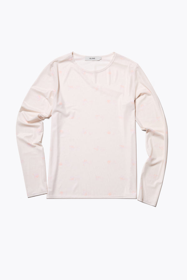 Spring Mesh Long Sleeve Top featuring a delicate floral print on lightweight, sheer mesh fabric. Ideal for layering under dresses or shirts. Available in 6 sizes. 