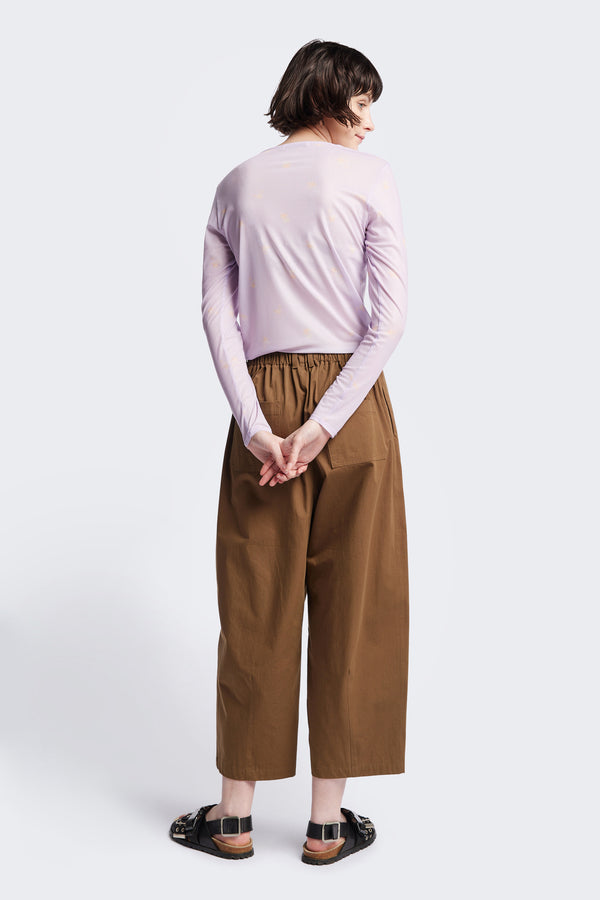 Back of the Spring Mesh Long Sleeve Top in lilac floral, featuring a delicate floral print on lightweight, sheer mesh fabric. Ideal for layering under dresses or shirts. Available in 6 sizes. 