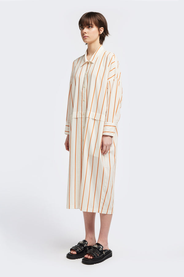 Front view of the Sundown Shirt Dress in Burnt Orange Stripe, a relaxed-fit, knee-length shirt dress with a cocooned back and front tuck detail.