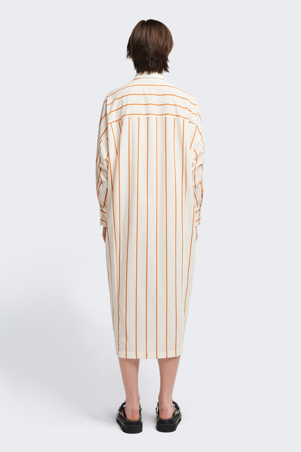 Back view of the Sundown Shirt Dress in Burnt Orange Stripe, a relaxed-fit, knee-length shirt dress with a cocooned back and front tuck detail.