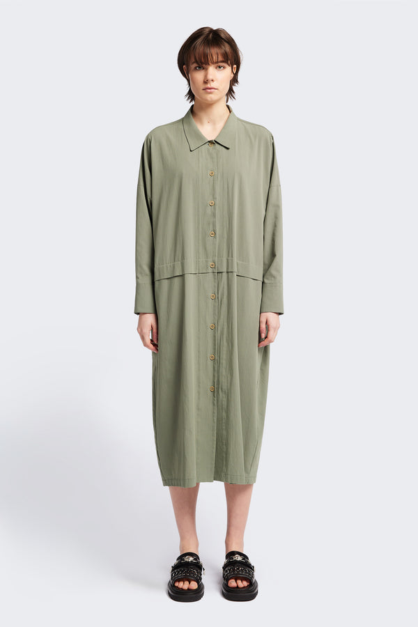 Front view of the Sundown Shirt Dress in Olive Green, a relaxed-fit, knee-length shirt dress with a cocooned back and front tuck detail.