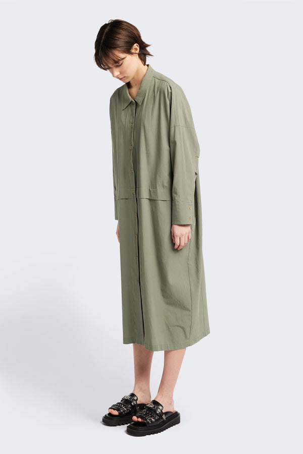 Front view of the Sundown Shirt Dress in Olive Green, a relaxed-fit, knee-length shirt dress with a cocooned back and front tuck detail.