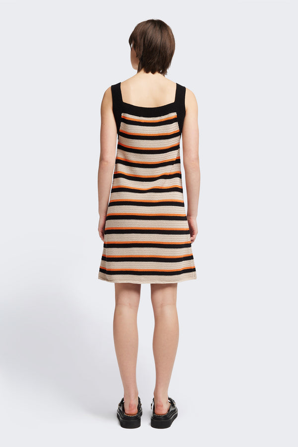 Back View: Temporal Dress in soft cotton yarn with shallow knit stripes in black, orange, and mushroom, featuring wide straps and a straight black neckline.